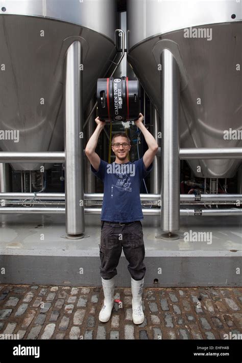 Staff Member Holding Beer Barrel At The Camden Town Brewery London