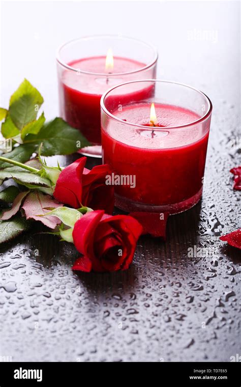 Beautiful Romantic Red Candles With Flowers Close Up Stock Photo Alamy