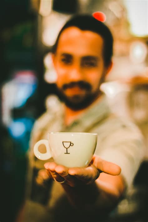 Fotos Gratis Vaso Naranja Taza De Caf Fotograf A Mano Drinkware