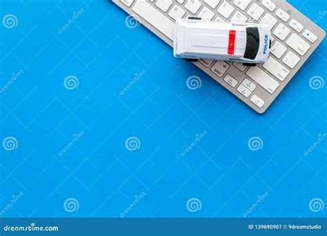 Call Police Online Concept. Police Car Toy and Computer Keyboard on Blue Background Top View ...