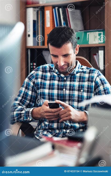 Businessman Using A Cellphone In An Office Stock Photo Image Of