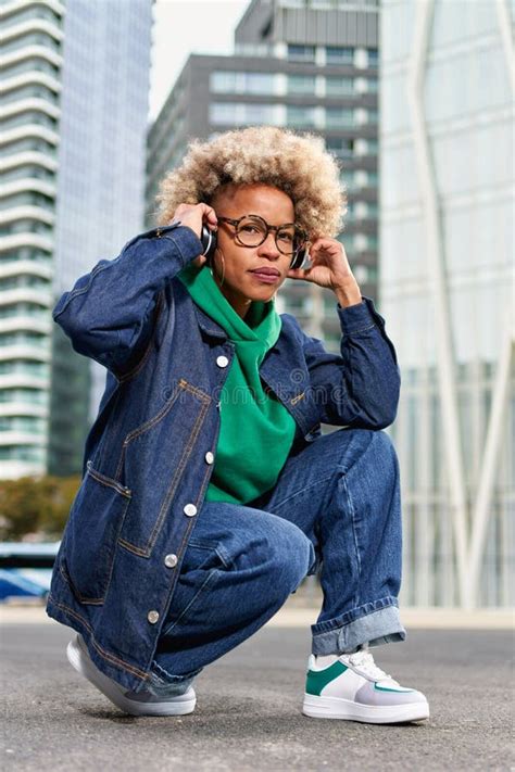 Portrait Of Attractive Mature Female Photographer Holding Camera