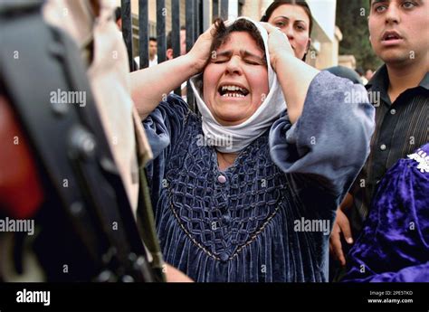 Gfile An Iraqi Woman Screams In Tears In Front Of The Security