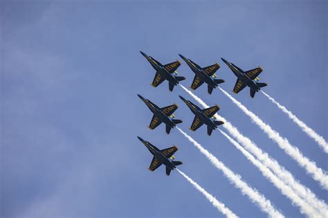 A Group Of Fighter Jets Flying Through A Blue Sky Photo Free Airplane