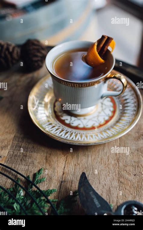 Hot Toddy With Orange In Teacup On Whiskey Barrel Stock Photo Alamy