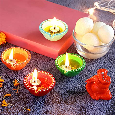 Buy Send Colourful Diyas Ganesha Idol With Rasgulla Online Fnp