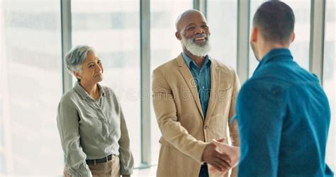 Handshake Welcome And Thank You With Business People In Office After