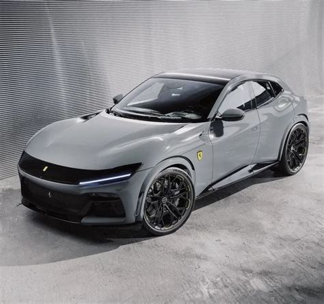 A Grey Sports Car Parked In Front Of A Wall