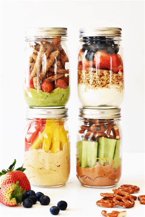 Three Mason Jars Filled With Fruit Nuts And Other Food Items Next To