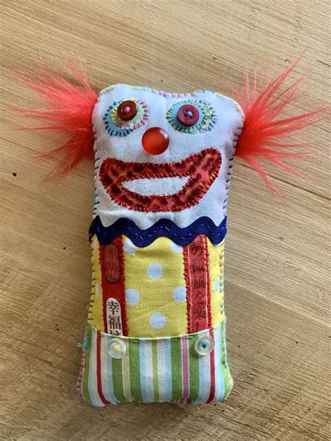 A Cell Phone Case With A Clown Face On It