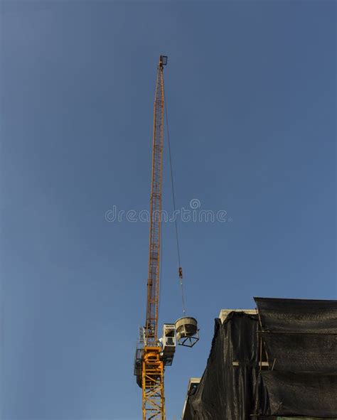 Tower Crane Lift Cement Bucket Up To Top Of Building Stock Image