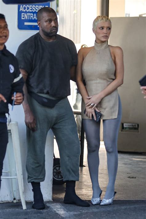 Kanye West squeezes wife Bianca Censori's butt and buries his head in her boobs in rare PDA ...