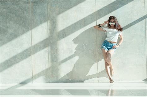 Fashion Portrait Of Young Model Posing By The Wall Stock Image Image