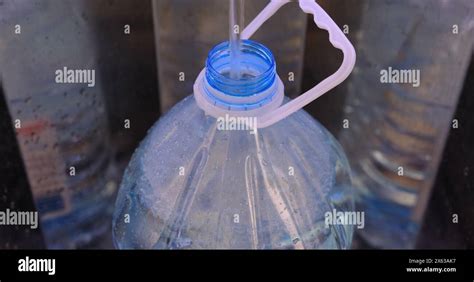 Close Up Of Pouring Water With Litre Plastic Water Bottle At Local