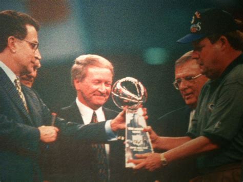 1996 Super Bowl Champion Green Bay Packers. Lombardi trophy being awarded to head coach Mike ...