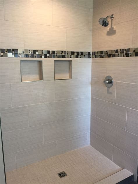 Custom Tiled Shower With Glass And Metal Mosaic Accent Strip