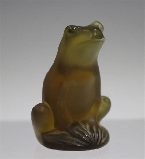 A Lalique glass model of a frog, modern, of brown tint, engraved ...