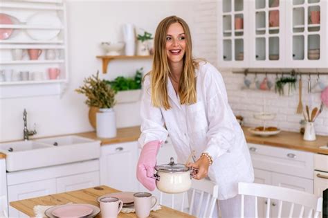 Premium Photo Stylish Blonde Woman Posing At Her Cute Kitchen Wearing