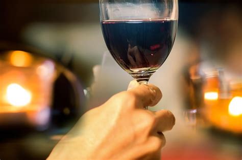 Premium Photo Close Up Of Hand Holding Glass Of Wine