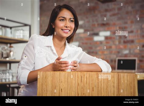 Pretty Brunette Having Cup Of Coffee Stock Photo Alamy