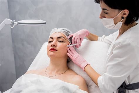 Premium Photo The Doctor Cosmetologist Makes The Facial Injections