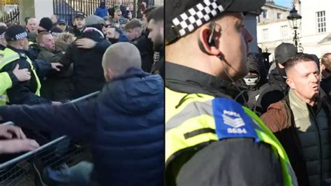 Fights break out as EDL founder Tommy Robinson and supporters shout ...