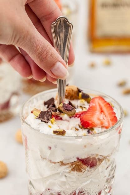 Premium Photo Midsection Of Person Holding Ice Cream