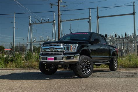 Custom Pink Ford F 150 That Is Lifted With A Pro Comp 6 Inch Lift Kit