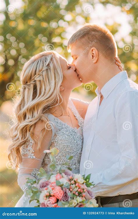 Tender And Sensual Kiss Of The Bride And Groom On Wedding Day The Girl