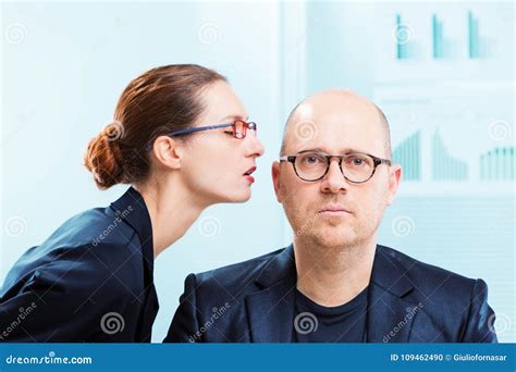 Man Whispering In Womans Ear