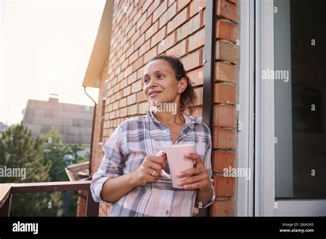 Beautiful Brunette Woman Drinking Coffee Enjoying Her Day Off Standing On Balcony Of Country