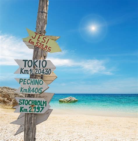 Premium Photo Wooden Signpost In A Tropical Beach