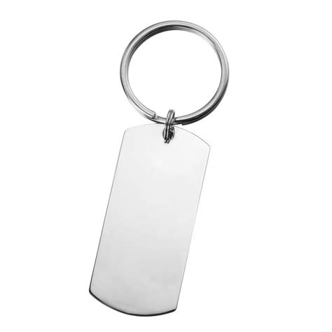 A Metal Keychain With A Blank Tag Hanging From It S Side On A White