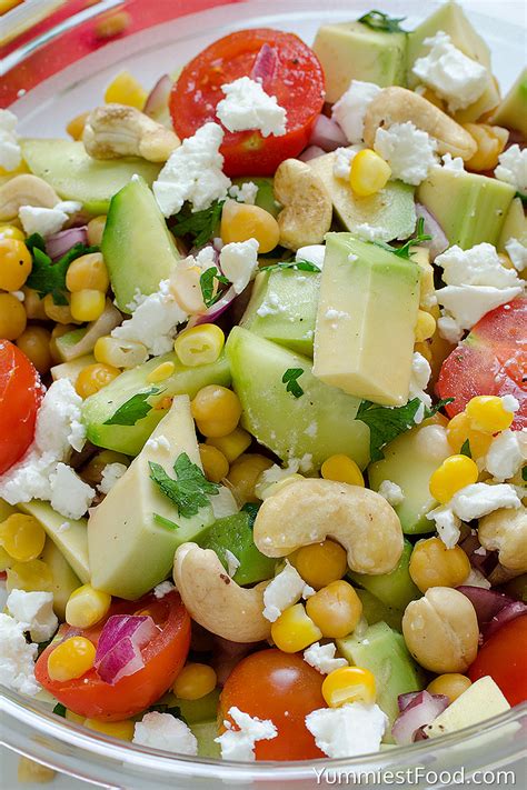 Avocado Tomato Cucumber Corn Chickpea And Cashew Salad With Feta Cheese