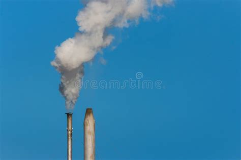 Factory Chimneys With Smoke Against Blue Sky Stock Image Image Of