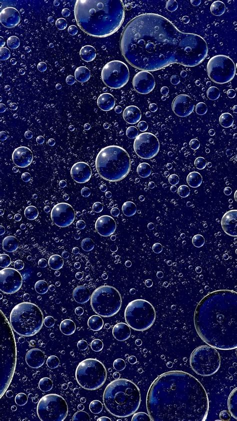 Water Bubbles Are Seen In This Blue Background