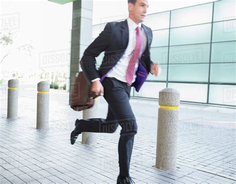 Businessman With Briefcase Running Stock Photo Dissolve