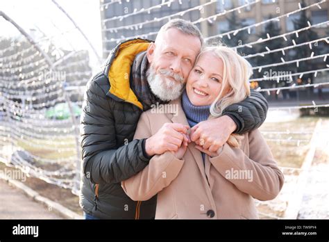 Happy Mature Couple Hugging Outdoors Stock Photo Alamy
