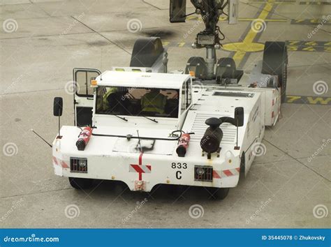 Tug Pushback Tractor In The Airport. Editorial Image | CartoonDealer.com #65768386