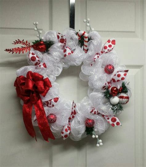 This Red And White Deco Mesh Wreath Is Adorned With All Of The Holiday