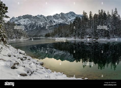 Beautiful snowy Lake Eibsee at winter Stock Photo - Alamy