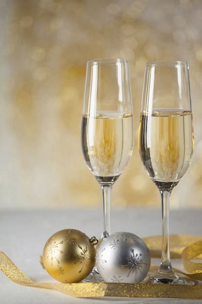 Free Photo | Glasses with champagne and gifts background