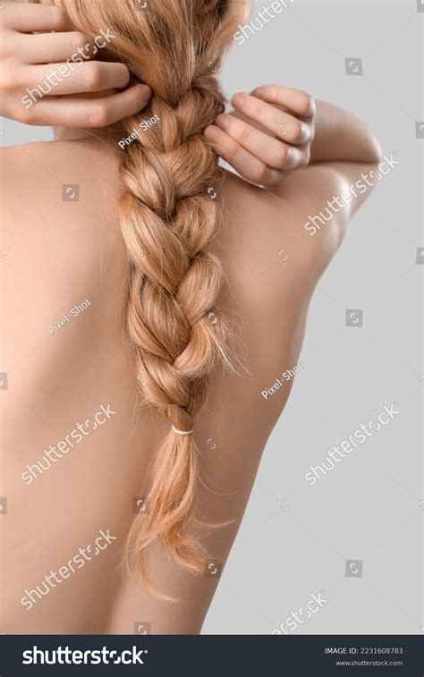 Blonde Woman Naked Back Adjusting Pigtail Stock Photo 2231608783
