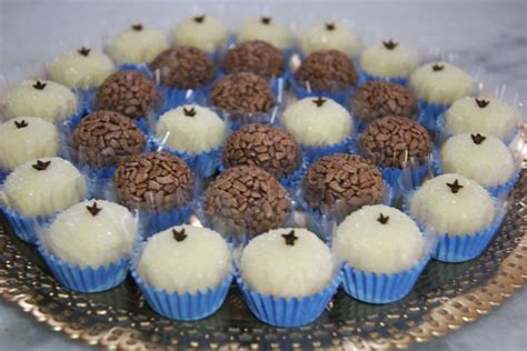 A Platter Filled With Chocolate And White Cupcakes