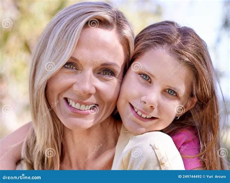 Shes My Angel A Smiling Mother With Her Daughter On Her Back While