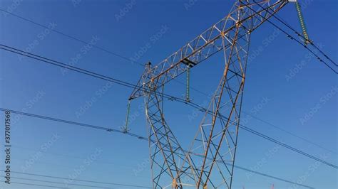 Stockvideo Transmission Tower Supporting An Overhead High Voltage Power