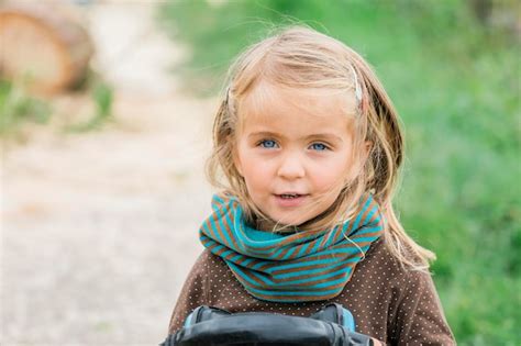 Premium Photo | Portrait of cute girl smiling outdoors