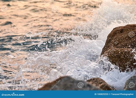 Waves Crashing On The Rocks At Sunset Stock Image Image Of Beach