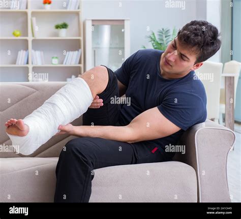 The Man With Broken Leg Recovering At Home Stock Photo Alamy