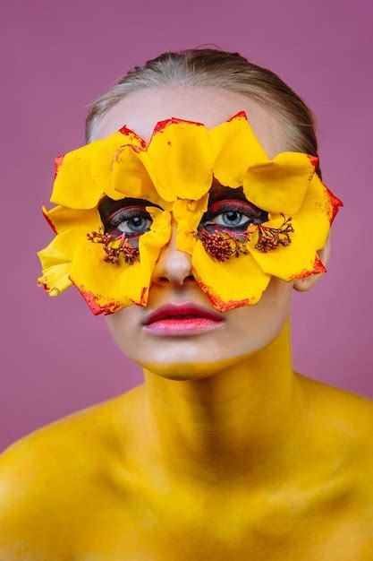 Premium Photo Woman Model With Yellow Flowers Around Her Eyes The